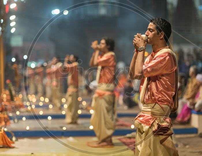 Priests Performing The Holy Aarti / harathi For River ganga in varanasi