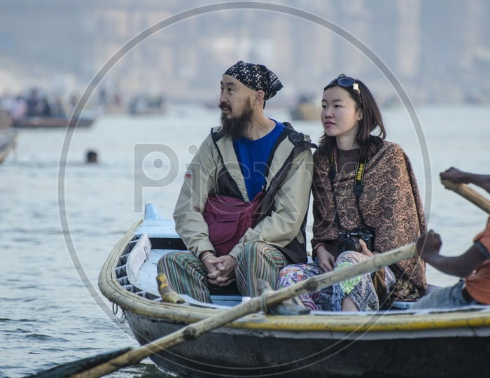 foreigners  exploring varanasi in boat / Boat ride in Varanasi