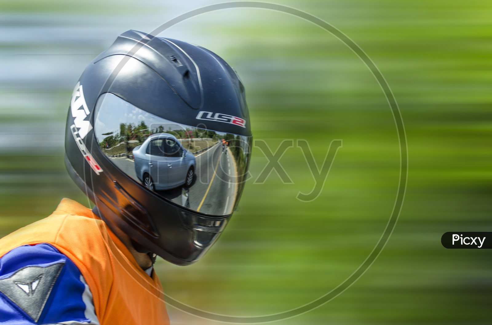 Bike rider with Helmet Panning Shot