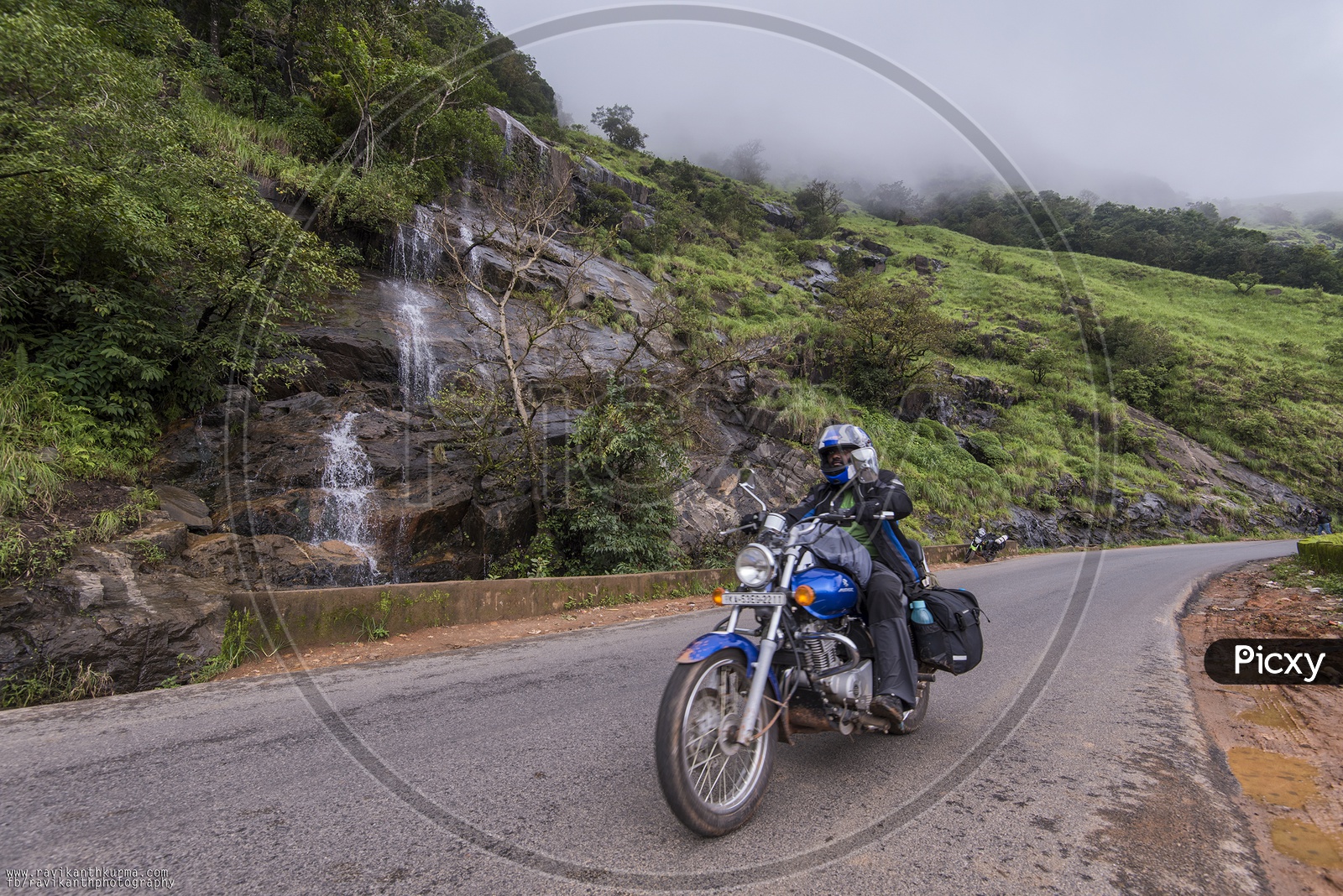 Image of Traveller riding bike on karnataka roadsBZ536309Picxy