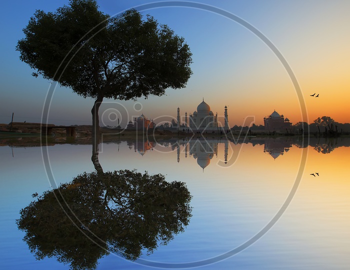 Landscape of Taj Mahal and reflections during sunset