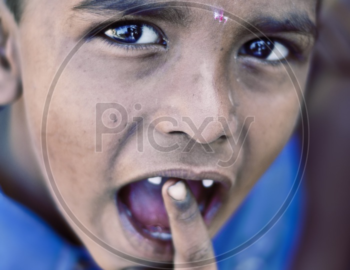 A child putting finger in his mouth