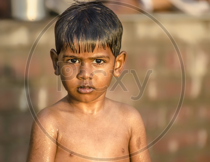 Portrait of Indian kid with beautiful sunlight
