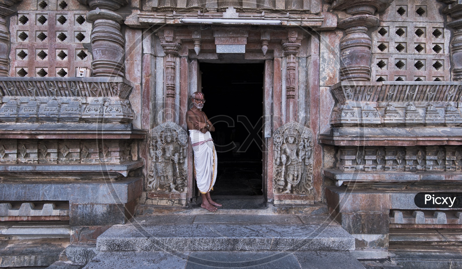 An Indian Hindu Priest Standing at a Temple Door Step