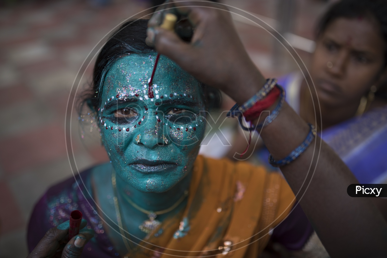 Indian hindu Devotee  Woman  In a makeup Session For Dussera Celebration ritual in Tamil nadu