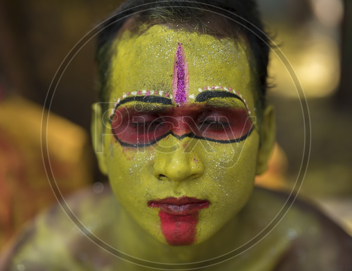 Indian hindu Devotee Boy In a makeup Session For Dussera Celebration ritual in Tamil nadu