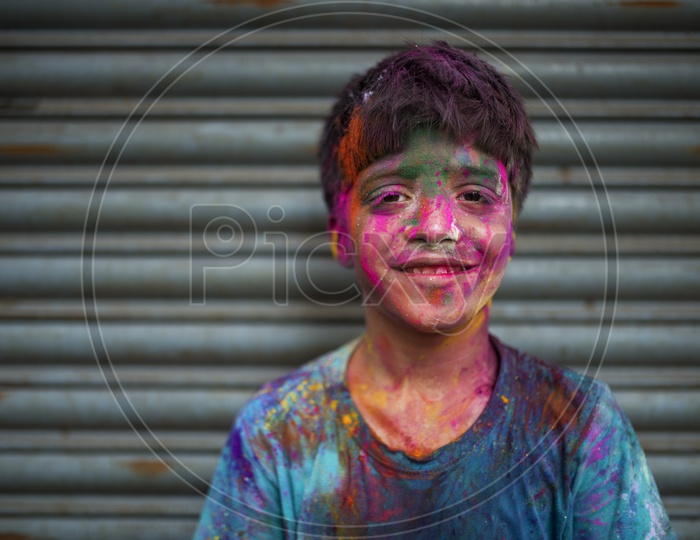 Kid with Colors on his face - Holi Celebrations - Indian Festival - Colors/Colorful