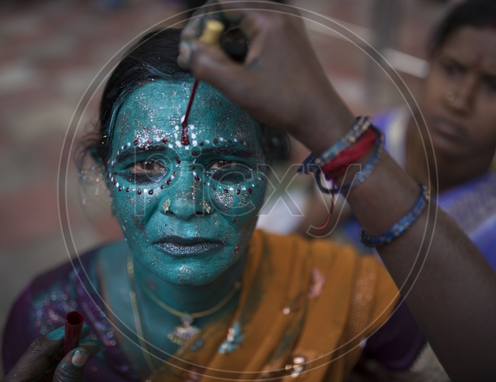 Indian hindu Devotee  Woman  In a makeup Session For Dussera Celebration ritual in Tamil nadu