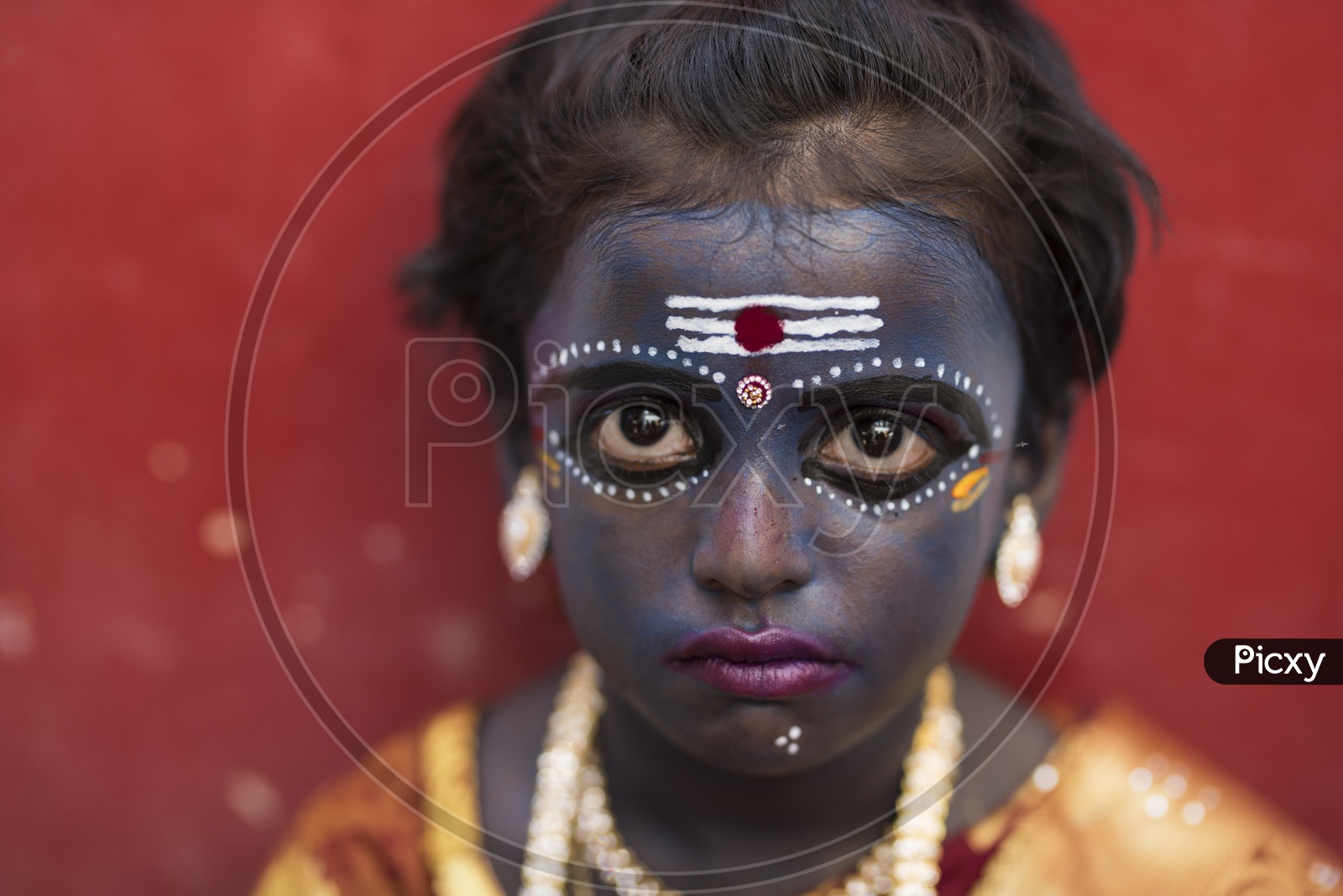A Girl Hindu Devotee makeup as Kaali maata in Dussera celebrations in tamil Nadu