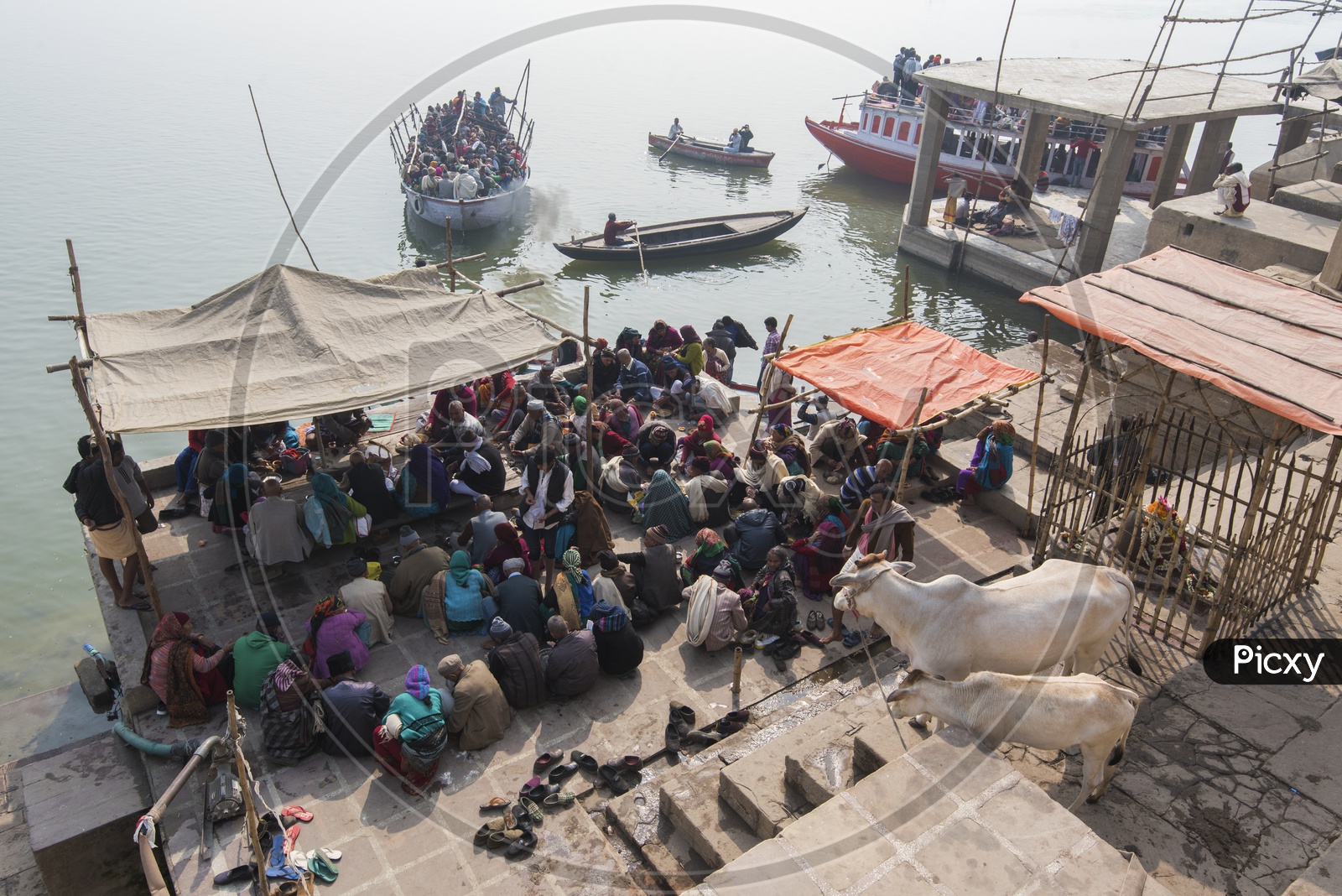 Passengers Waiting at the river bank for the Sailing Boats in Varanasi