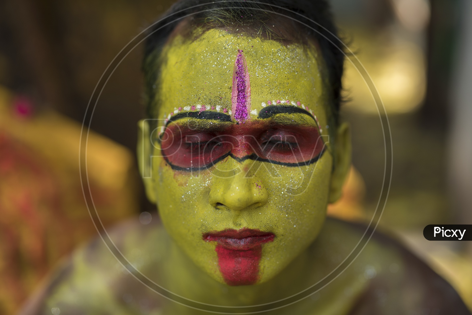 Indian hindu Devotee Boy In a makeup Session For Dussera Celebration ritual in Tamil nadu