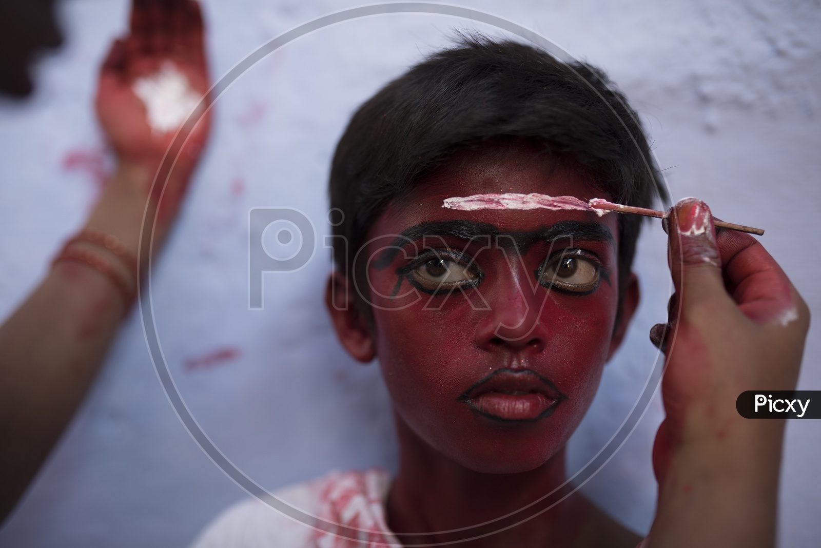 People with colored face for Kaveripattinam Angalamman Festival Celebrations