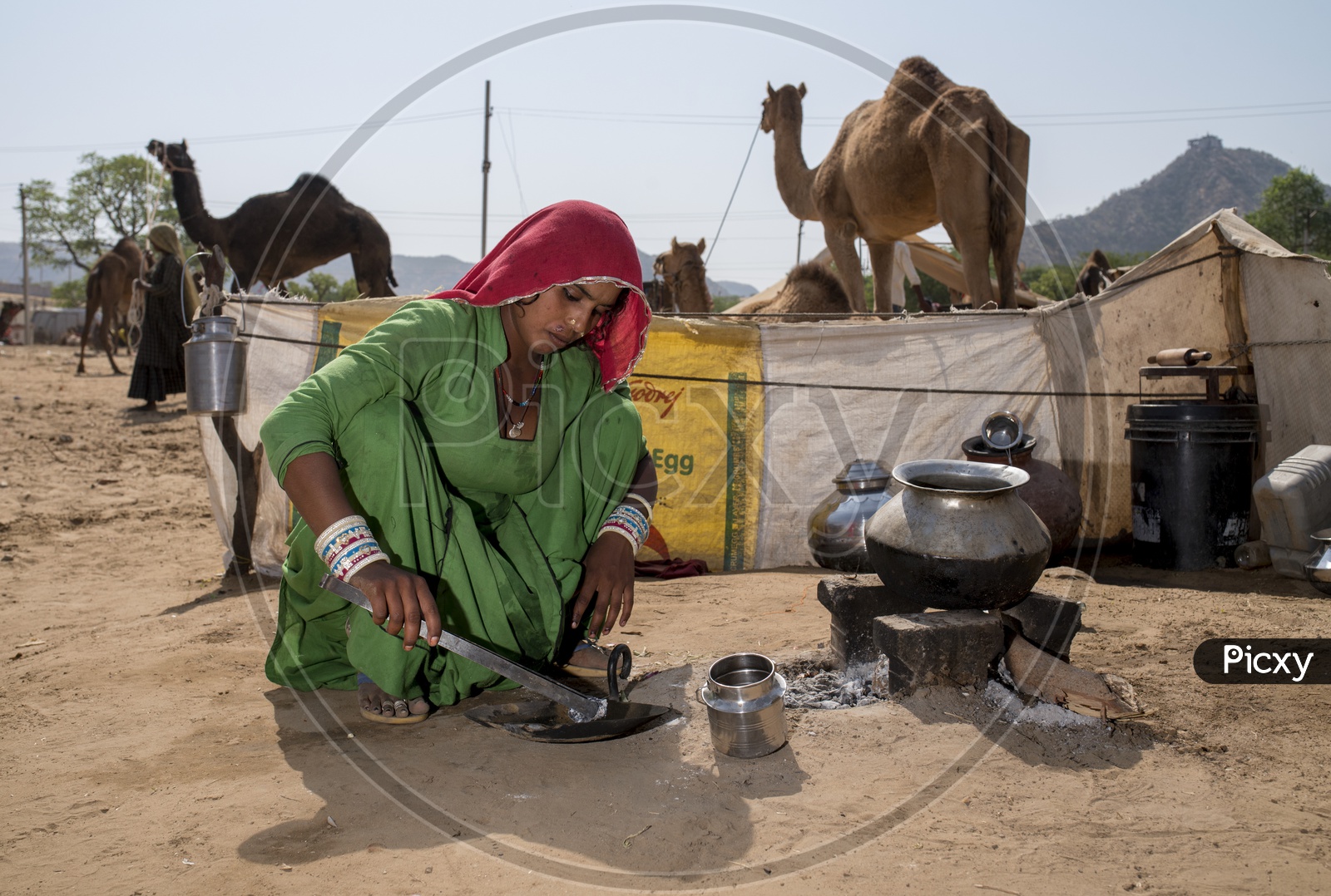 A Woman Making Food At The Pushkar Camel Fair