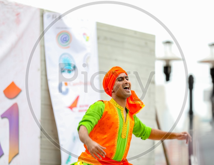 Man dancing at Holi Celebrations - Indian Festival - Colors/Colorful