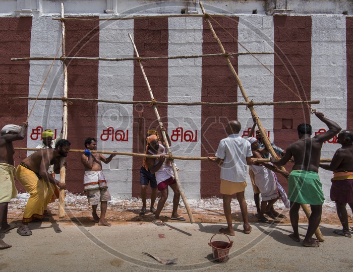 Workers painting a Hindu temple in Tamil Nadu