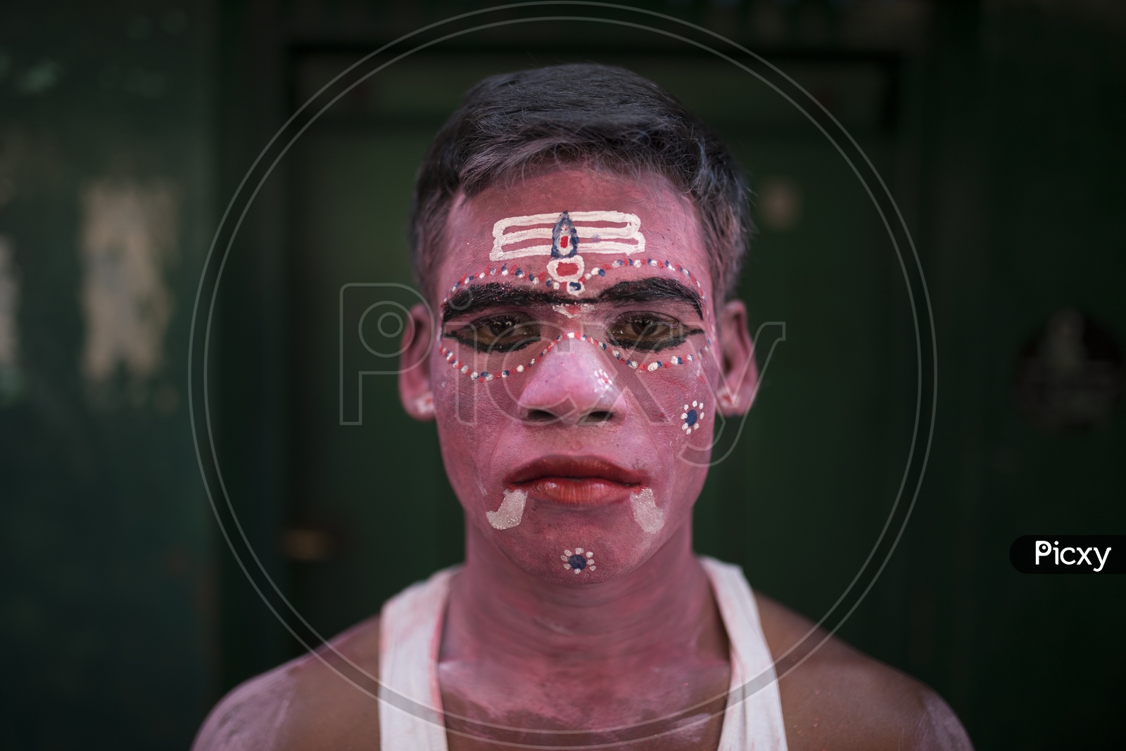 People with colored face for Kaveripattinam Angalamman Festival Celebrations