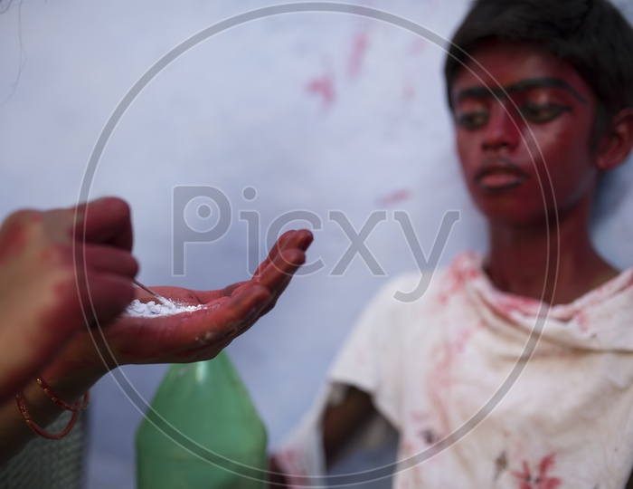 An Makeup Artist Doing makeup For a Boy in Dussera Celebrations in Tamil Nadu