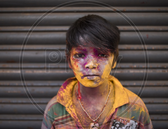 Kid with Colors on face - Holi Celebrations - Indian Festival - Colors/Colorful