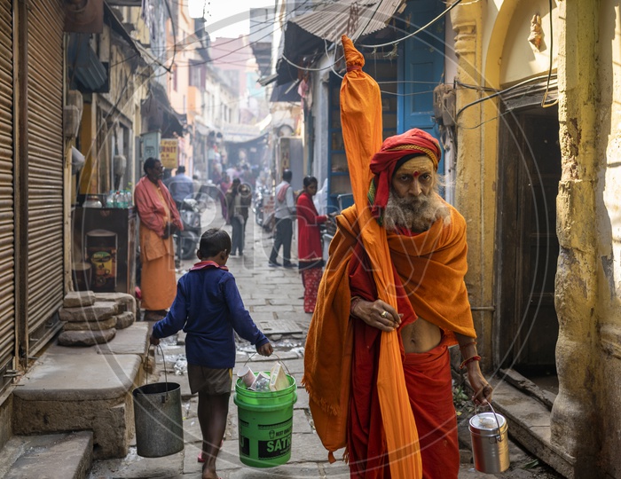 Sadhu walking in streets of varanasi