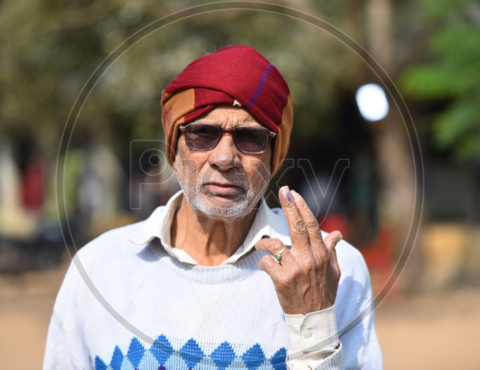 An Old Man Showing The Voting ink on His Finger After Casting His Vote in Telangana Panchayath Elections 2019