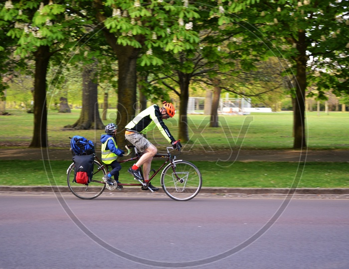 Father Son Duo Cycling in park