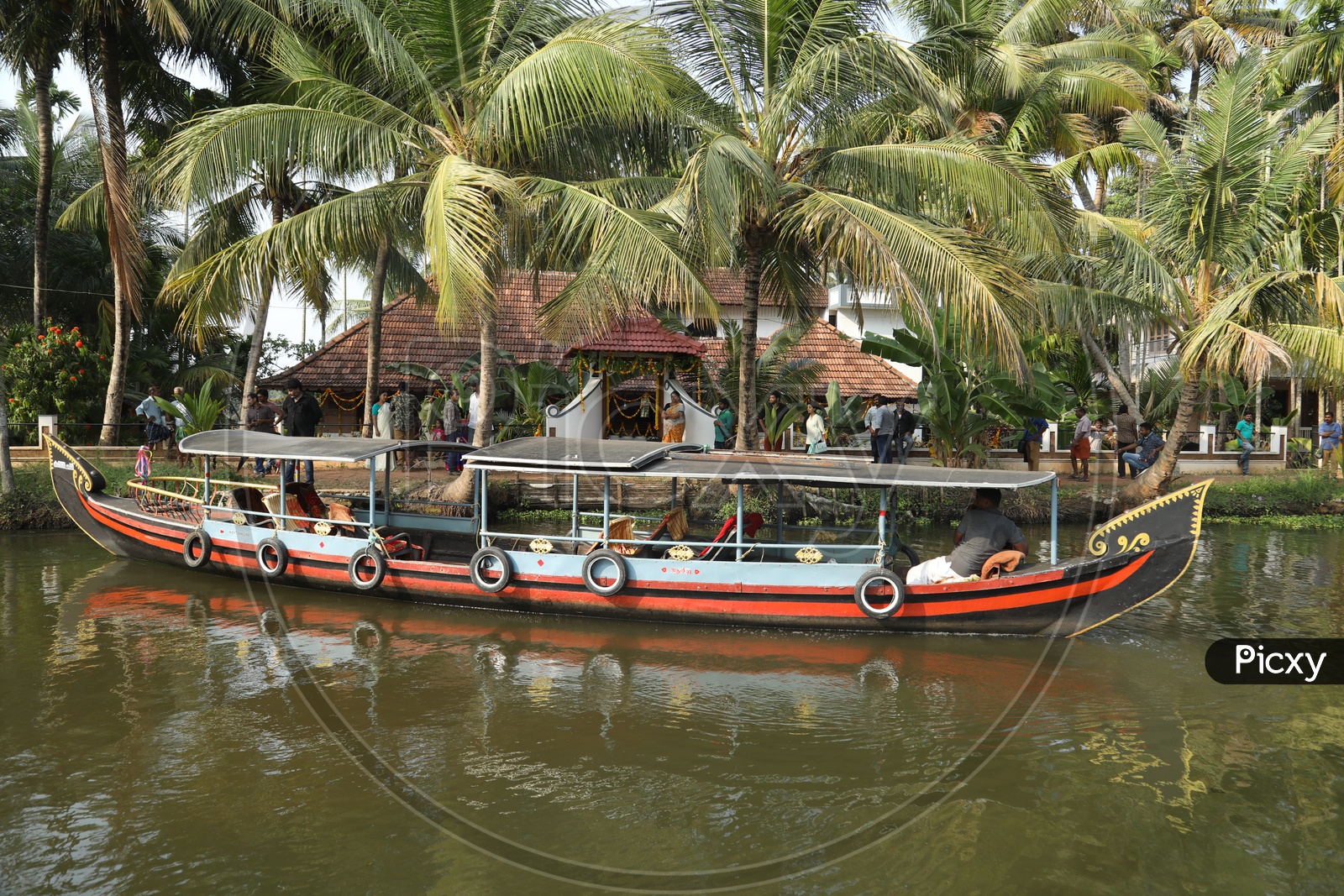 Boat sailing in local lake in Kerala