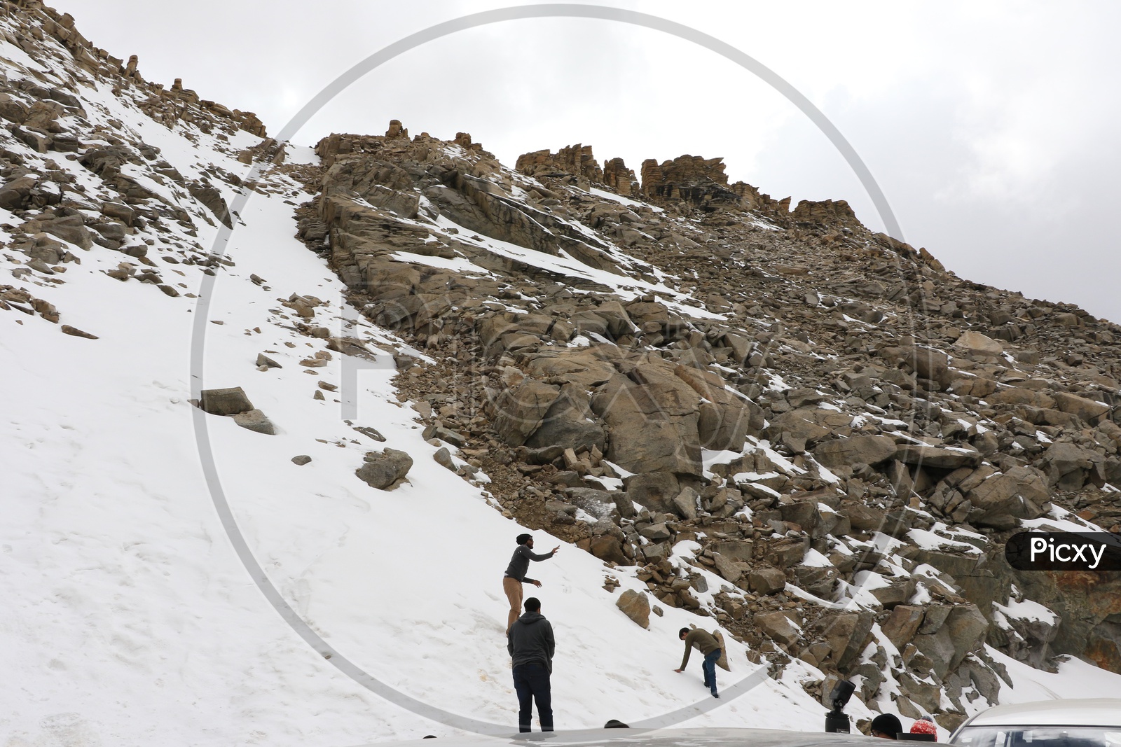 Travelers playing with snow on the mountains in leh