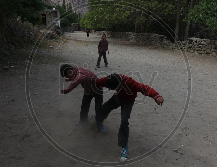 School Kids playing football in leh