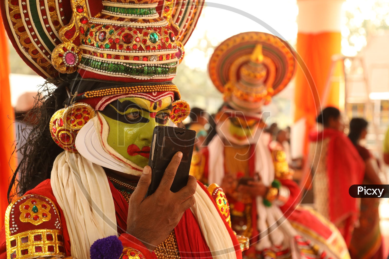 Kathakali Dancer talking over Mobile
