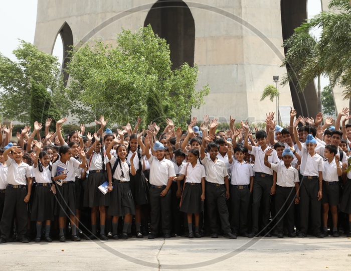 School Children Waving Hands As a Group