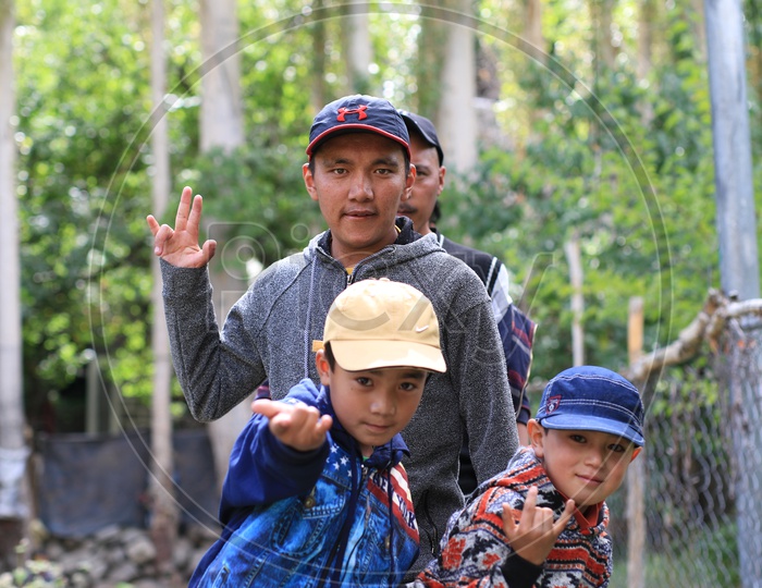 photograph of kids posing towards the camera