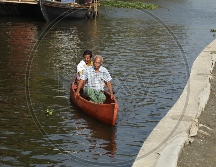 People traveling in mini boat in kerala
