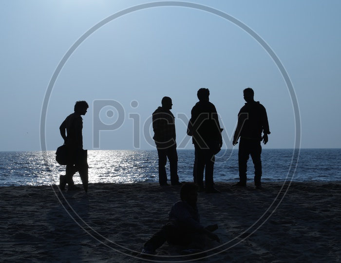 Silhouette of people at a beach
