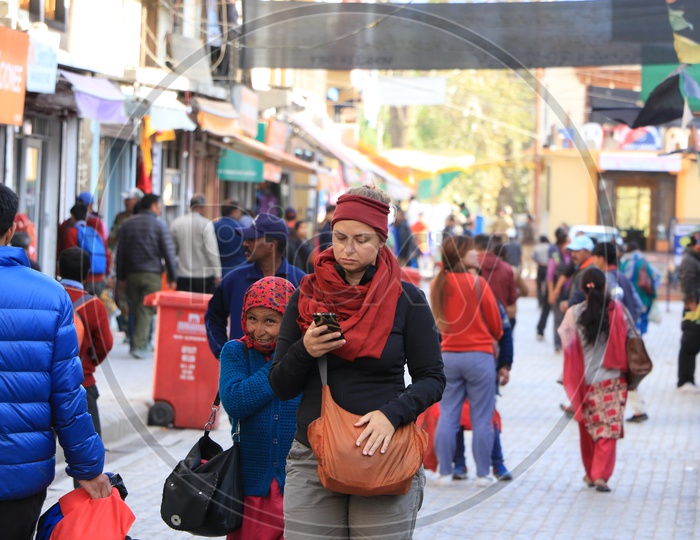 Foreigner with an old lady on the streets of Leh