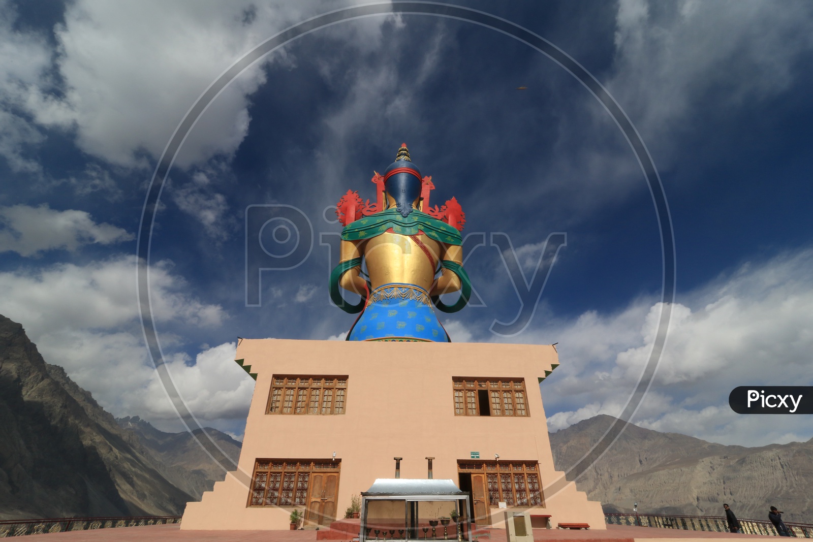 Back view of Buddha statue with beautiful mountains of leh