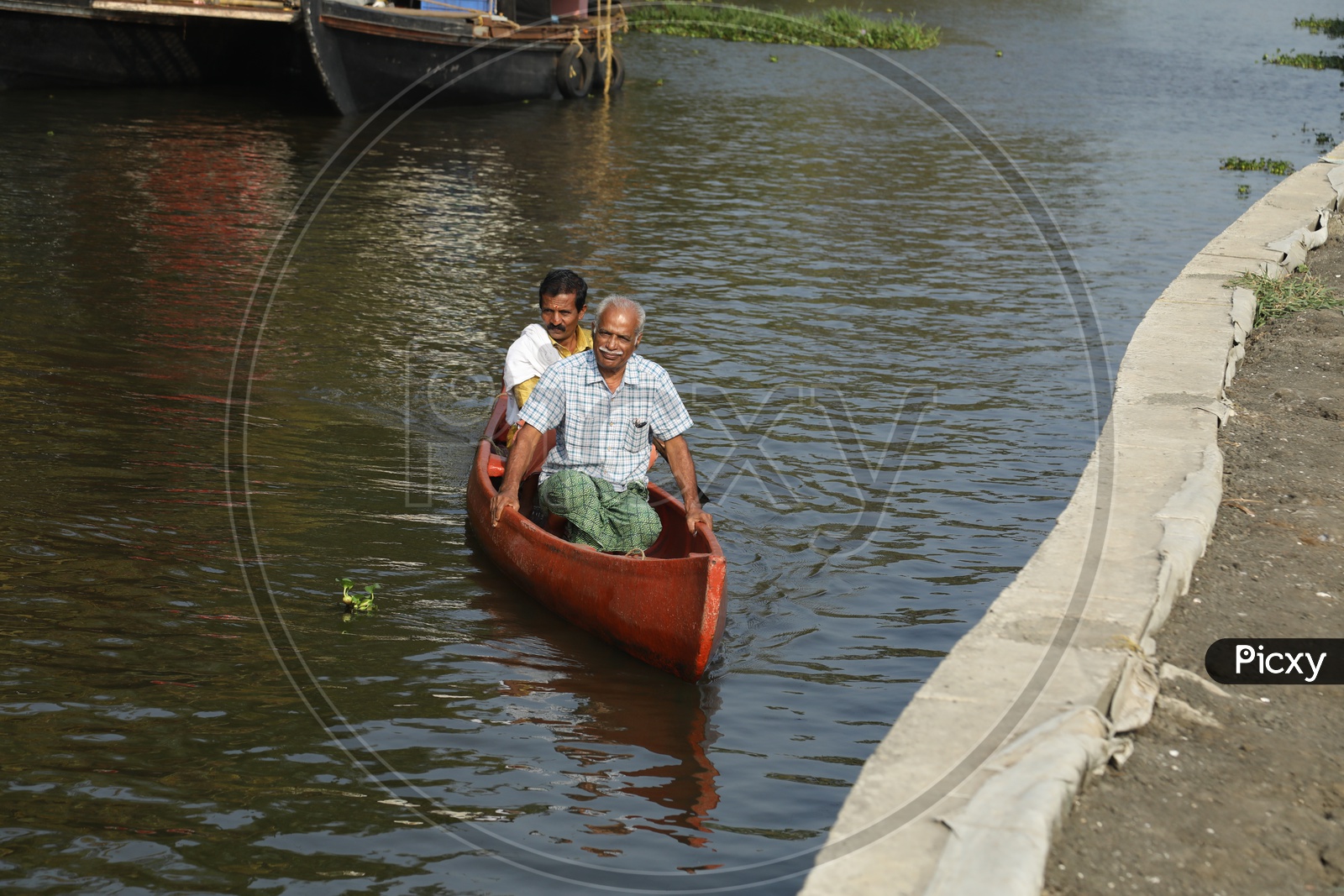 People traveling in mini boat in kerala