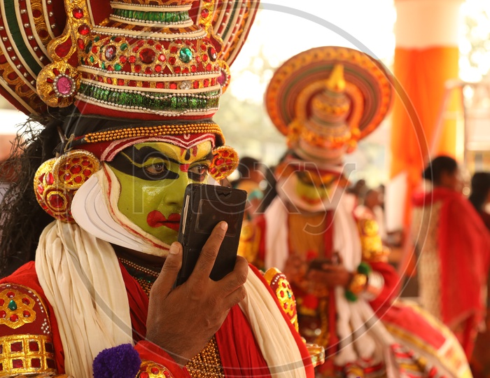 Kathakali Dancer talking over Mobile