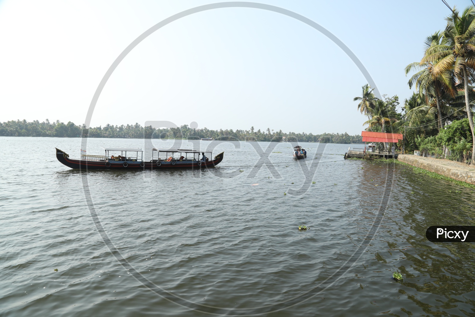 people traveling in boats in kerala local river