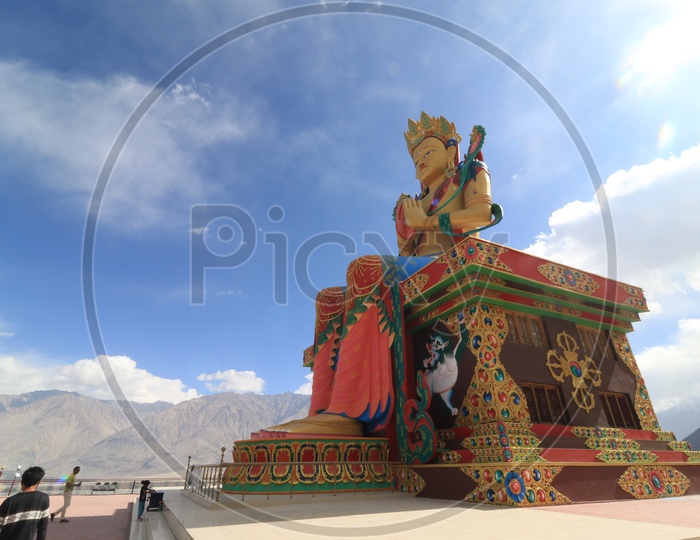 Buddha Statue with mountains