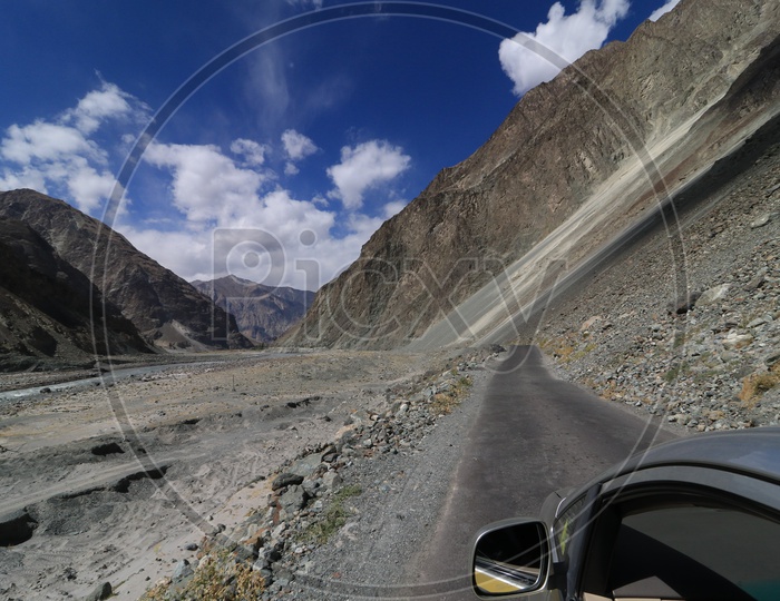 Roadways of leh with beautiful mountains in the background captured from moving car