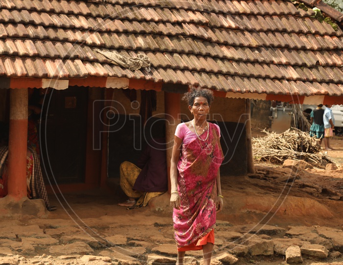 Women standing infront of house
