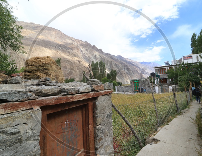 Landscape of beautiful Mountains of Leh with houses in the fotrground