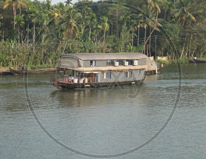 Boats sailing in water in kerala