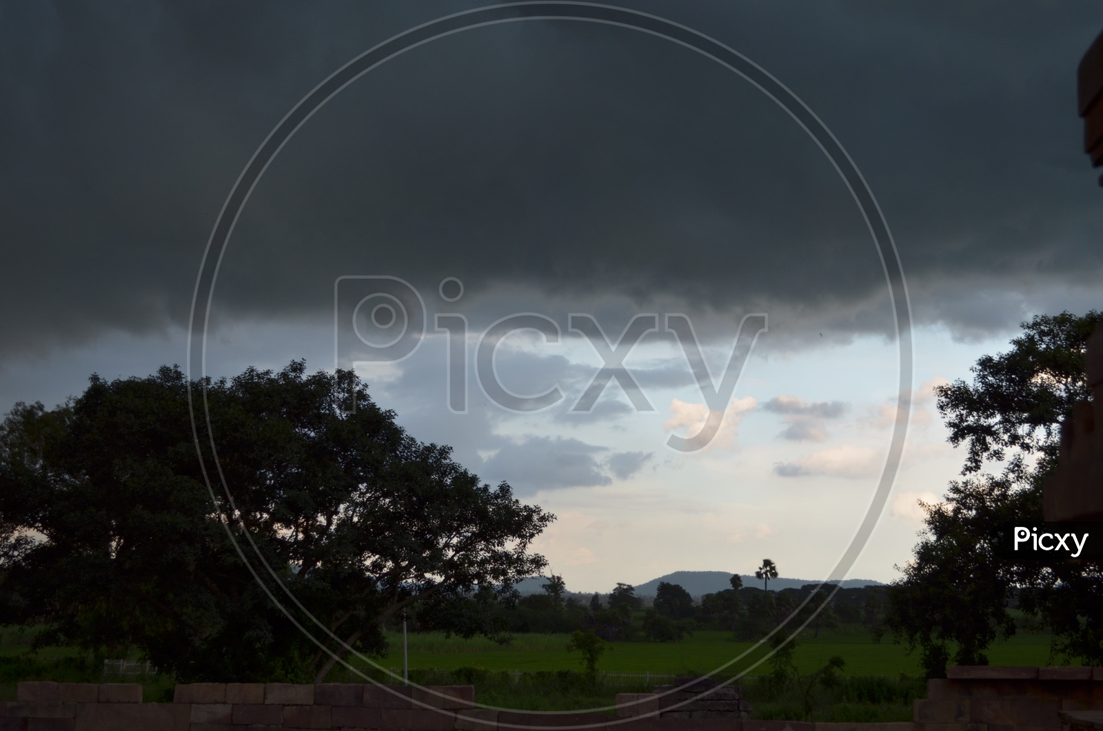 Dark Clouds in Sky at A Agricultural Field