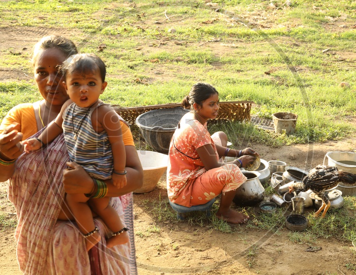 Woman Washing Cooking  utensils In  Rural India