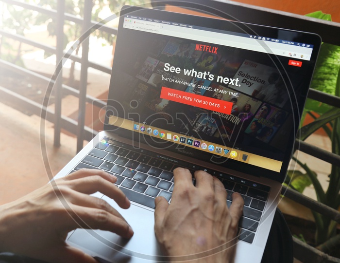 Indian user watching Netflix on Laptop