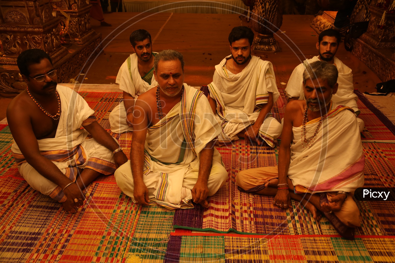 Indian Hindu  Priests Sitting on Traditional Mats
