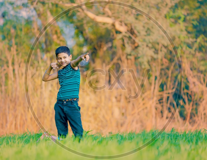 Indian Rural Boy in Agricultural Fields with Smiling Face and Expression
