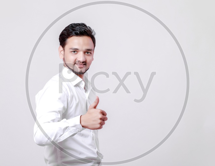 Indian Young Professional Man With a Smiling Face and Doing Gestures  On an Isolated White Background