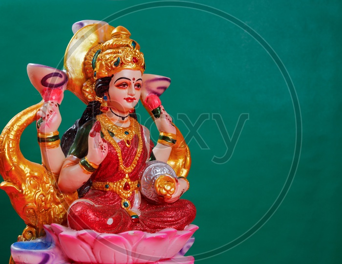 Sri Lakshmi Devi Idol with green background